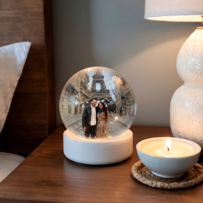 Forever Memory Sphere placed on a bedside table with a personalized photo inside the crystal ball in a cozy bedroom setting