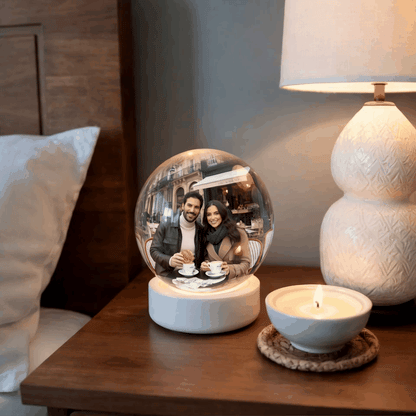 Forever Memory Sphere changing photos inside the crystal ball showing personalized memories in a cozy bedroom setting